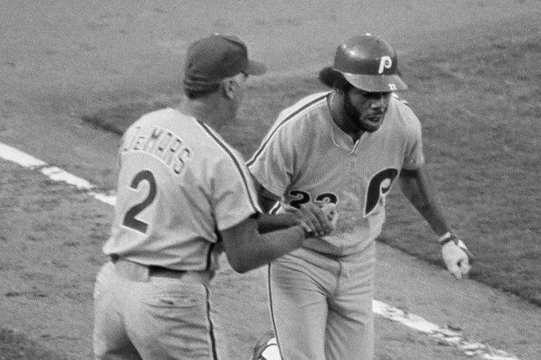 Bake McBride of the Phillies is congratulated by Billy DeMars as he rounds third base after hitting a home run during the NL playoffs against the Dodgers in 1977.