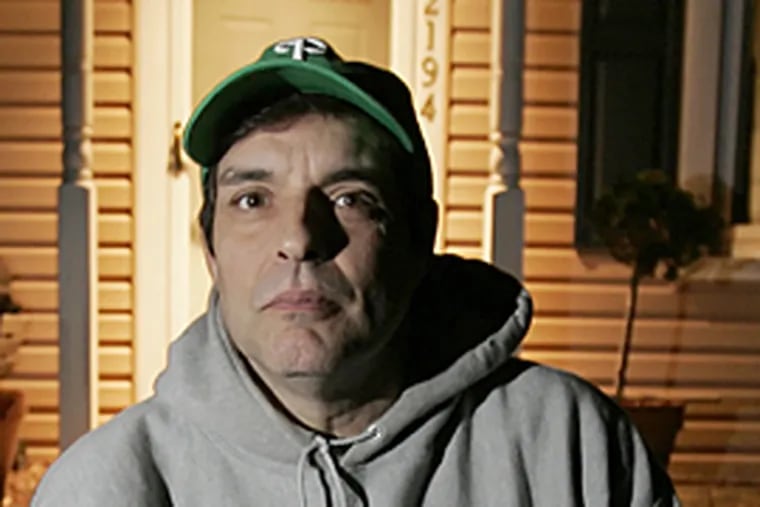 Frank Salamone outside his Bucks Co. home. He and his wife refinanced the house five times, and are now working second jobs to avoid foreclosure.