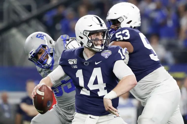 Penn State quarterback Sean Clifford (14) and new offensive coordinator Kirk Ciarrocca are working together on the revamped Nittany Lions offense.