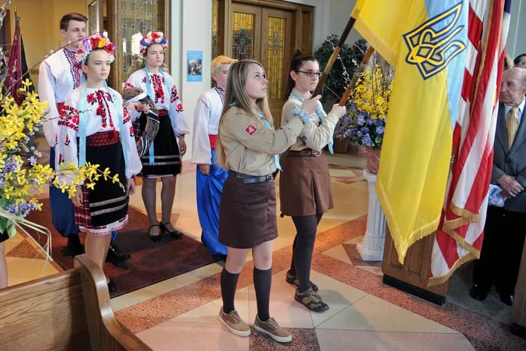 Plast Scouts (front) and Ukrainian Heritage School students (rear) lead a procession.