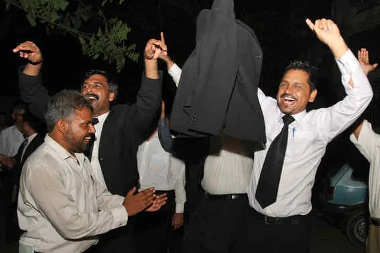 Lawyers in Karachi, Pakistan, celebrating the Supreme Court decision. President Pervez Musharraf's moves had fueled a protest movement of lawyers and civil-society advocates.