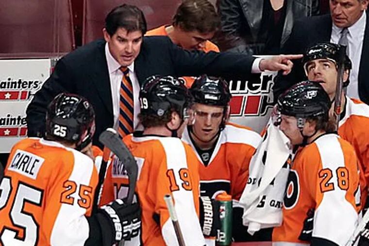 "We need to be better in the third period," Flyers coach Peter Laviolette said. (Steven M. Falk/Staff Photographer)