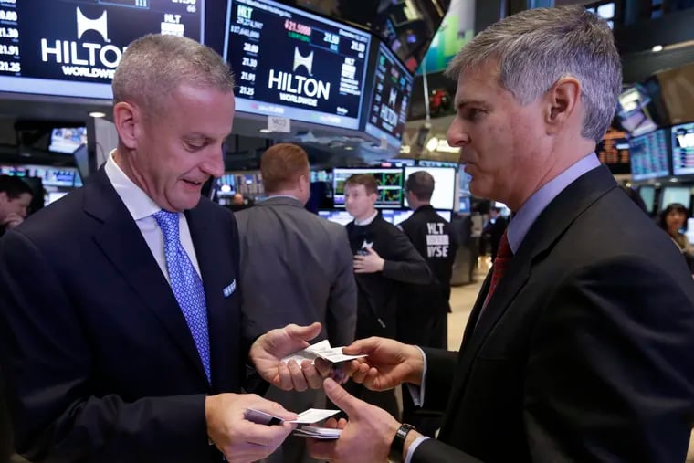 Aramark President and CEO Eric Foss, left, on the floor of the New York Stock Exchange on Dec. 12, 2013, the day Aramark most recently went public.