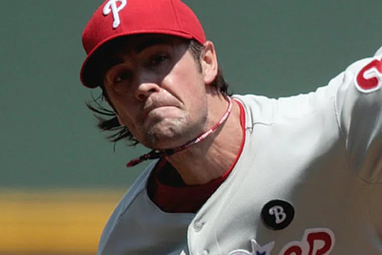 Cole Hamels allowed just five batters to reach base Sunday, and retired the first 10 Braves he faced. (David Goldman/AP)