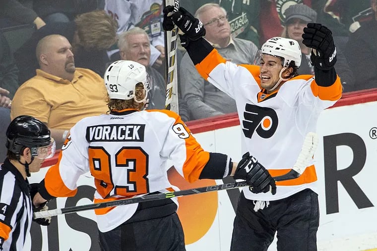 Philadelphia Flyers defenseman Michael Del Zotto (15) celebrates his goal with forward Jakub Voracek (93) during overtime against the Philadelphia Flyers at Xcel Energy Center. The Flyers defeated the Wild 4-3 in overtime.