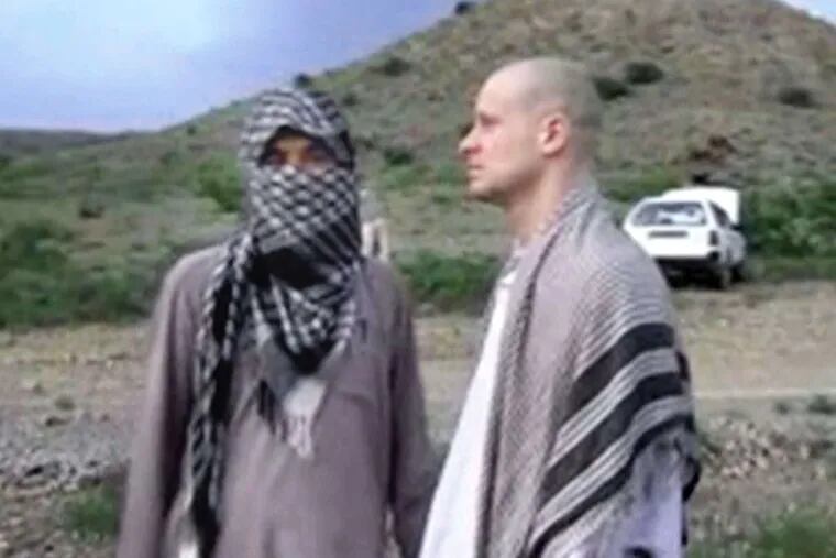 Bowe Berghdahl (right) with a Taliban fighter in Afghanistan before his 2014 release.