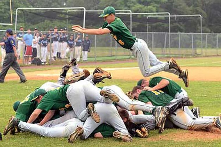 Audubon second baseman Justin Jannetti jumps into the fray to celebrate with his teammates. (Tom Gralish/Staff Photographer)