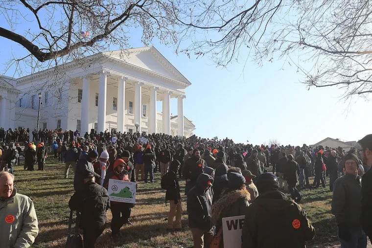 Gun rights protestors gather under the Virginia State Capitol for a rally in support of Second Amendment rights on Monday.