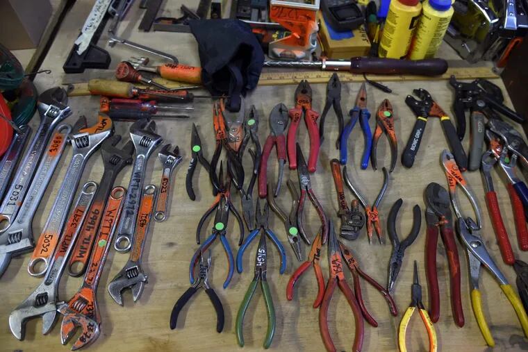 Homeowners should stock their tool boxes with the basics, including a needle-nose pliers, shown here at the West Philly Tool Library.