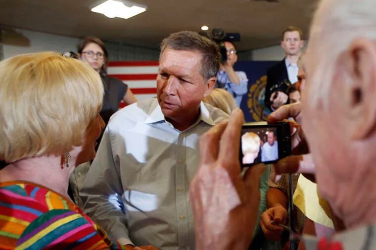 Ohio Gov. John Kasich getting his picture taken as he talks with Granite State voters at a town hall meeting July 21 in Nashua, N.H.