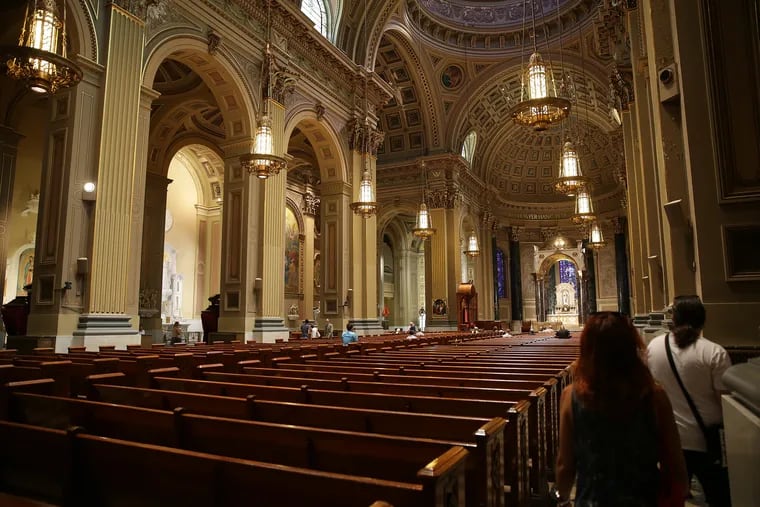 Visitors arrive before a mass at Cathedral Basilica of Saints Peter and Paul in Philadelphia, PA on August 15, 2018.