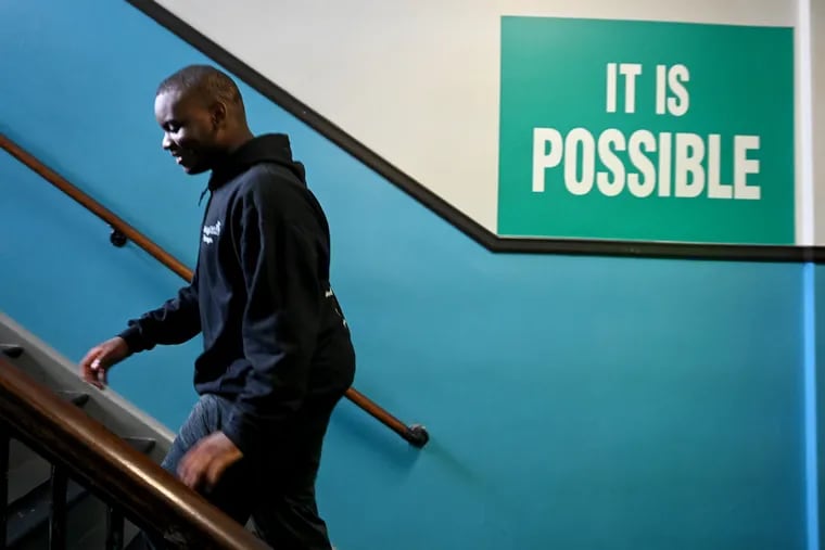 Christin White, 14, a recent eighth-grade graduate at Nebinger Elementary in South Philadelphia, walks up the stairs at the school Monday. Christin and two of his classmates campaigned to give more city eighth graders access to algebra.