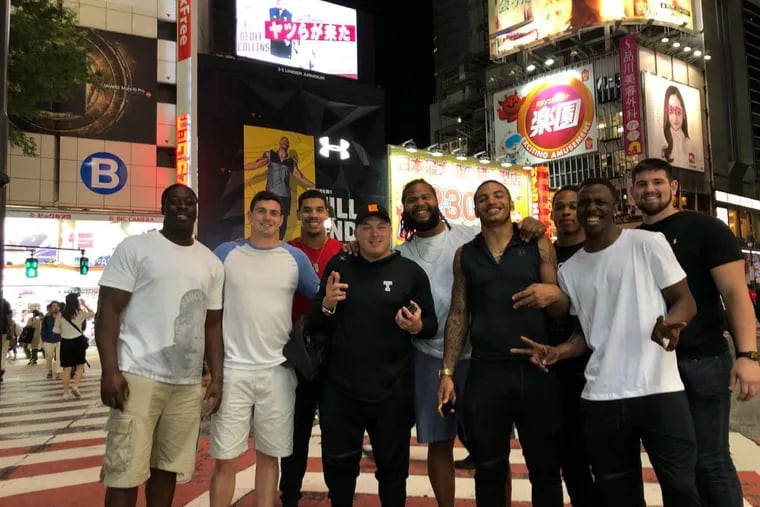 Temple Football players and coach Geoff Collins in Japan