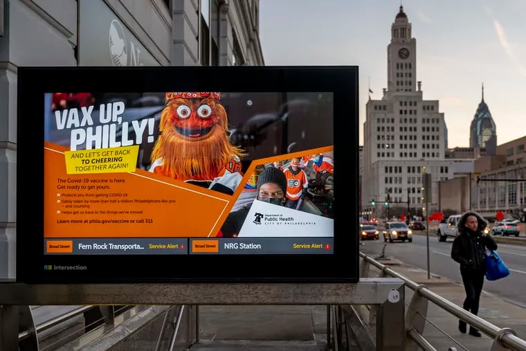 A Philadelphia Department of Public health public service vaccine advertisement featuring Gritty is on a monitor at the SEPTA Broad Street Line stop at Spring Garden Street.