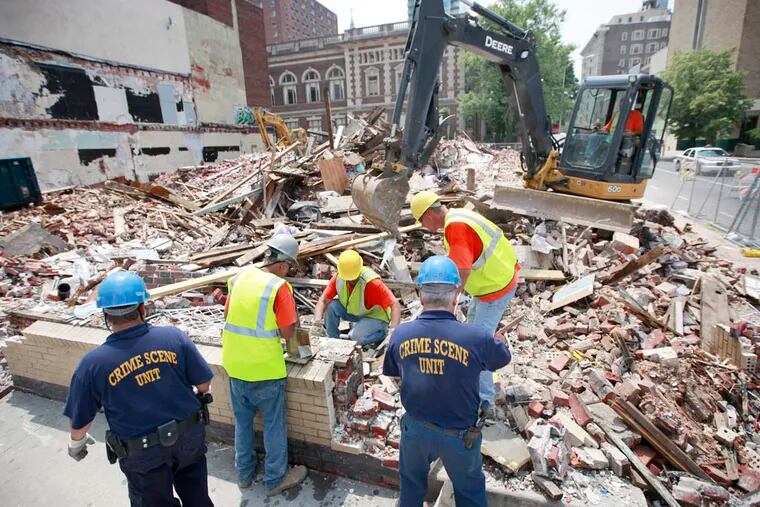 Demolition begins again at the site of the fatal building collapse at 22nd and Market Streets in 2013. (File photo: David Swanson / Staff Photographer)