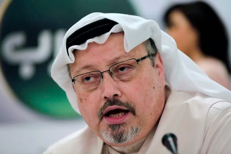 In this Dec. 15, 2014 file photo, Saudi journalist Jamal Khashoggi speaks during a press conference in Manama, Bahrain. An independent U.N. human rights expert investigating the killing of Saudi journalist Jamal Khashoggi is recommending an investigation into the possible role of Saudi Crown Prince Mohammed bin Salman, citing "credible evidence."