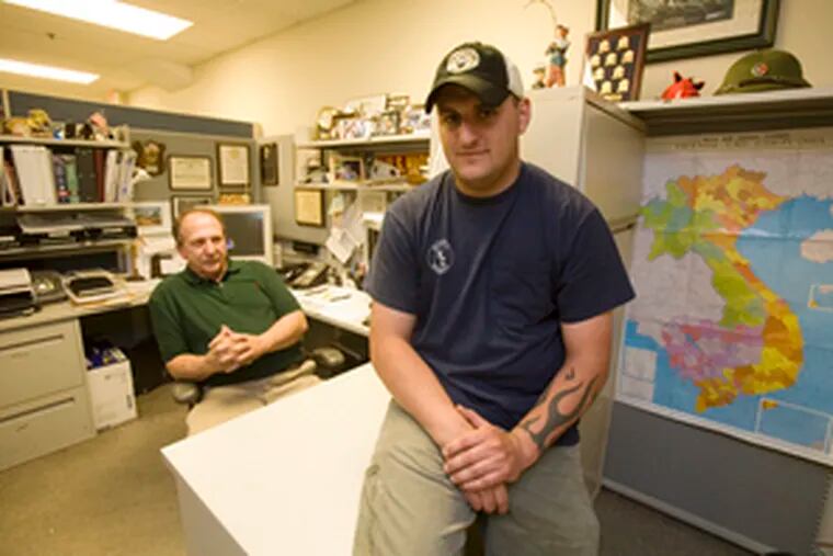 Iraq veteran Dave Albright (right) and counselor Dave Douglas, a Vietnam veteran, at the Veterans Multi Service and Education Center.
