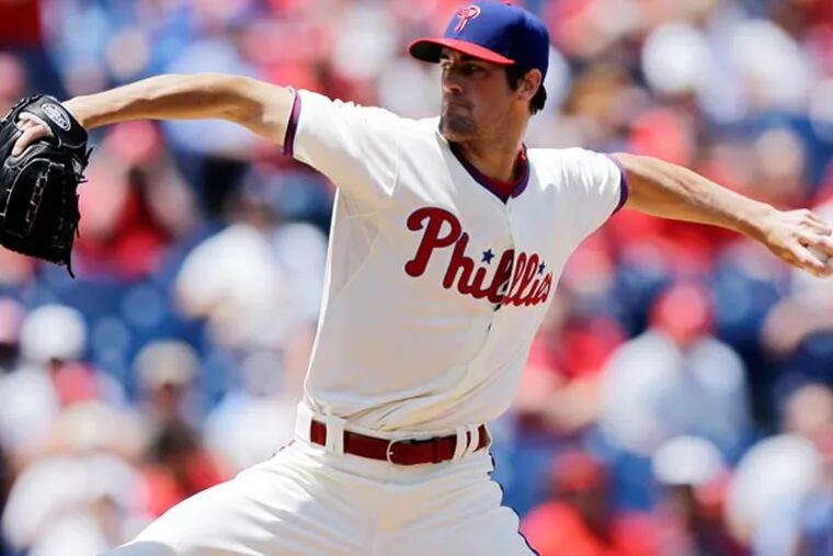 Cole Hamels pitches in the first inning of a baseball game against the Miami Marlins, Wednesday, June 5, 2013, in Philadelphia. (Matt Slocum/AP)