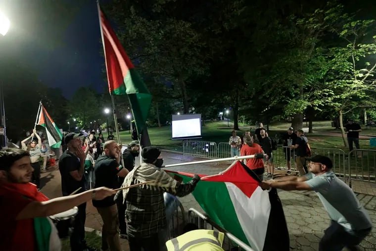 Tensions grew when a Palestinian flag being flown by the pro-Palestinian group flew in the face of a pro-Israel supporter who then grabbed the flag and tried to pull it away. Penn police and Philadelphia civil affairs officers then stepped in to calm things down on College Green in the heart of the University of Pennsylvania campus in Philadelphia on Thursday, May 2, 2024.
