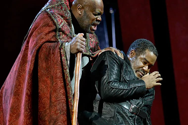 Morris Robinson, left, is the Grand Inquisitor and Eric Owens is King Philip II in Opera Philadelphia's production of Verdi's &quot;Don Carlo&quot; at the Academy of Music. (TOM GRALISH / Staff Photographer)