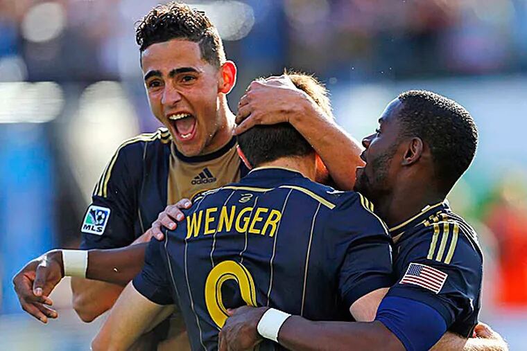 The Union's Leo Fernandes, Maurice Edu and Andrew Wenger. (Rich Schultz/AP)