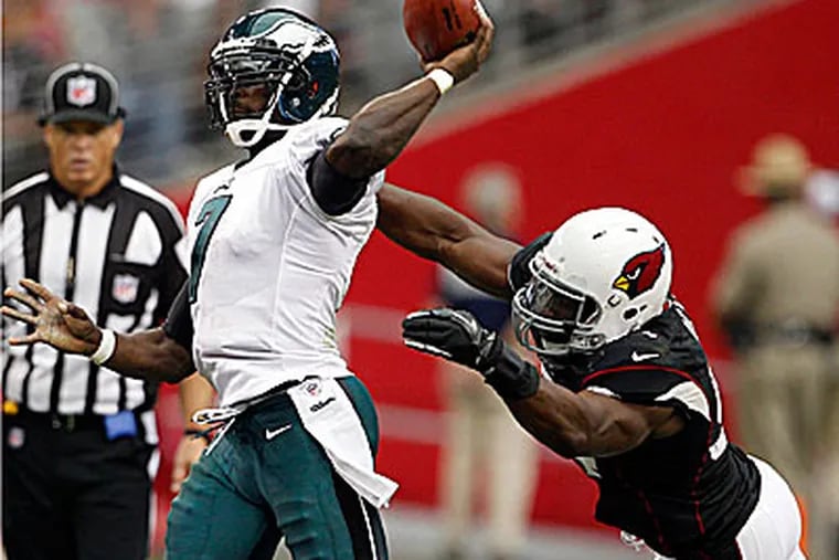 Eagles quarterback Michael Vick was sacked five times in the loss to Arizona. (Yong Kim/Staff Photographer)