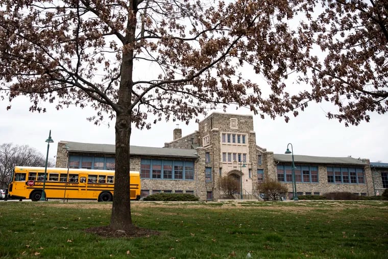 A school bus leaves during early dismissal outside of Merion Elementary School on March 12. Students did not return for the remainder of the school year.