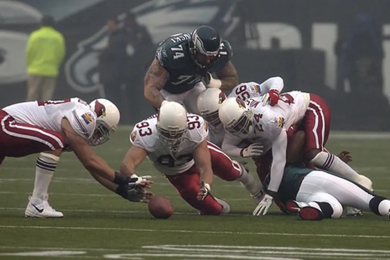 The NFL players' union is concerned about the long-term health risks of PFAS, nicknamed "forever chemicals," that are present in artificial turf. Veterans Stadium, shown above during a 2002 game between the Eagles and Arizona Cardinals, had turf fields for 33 years.