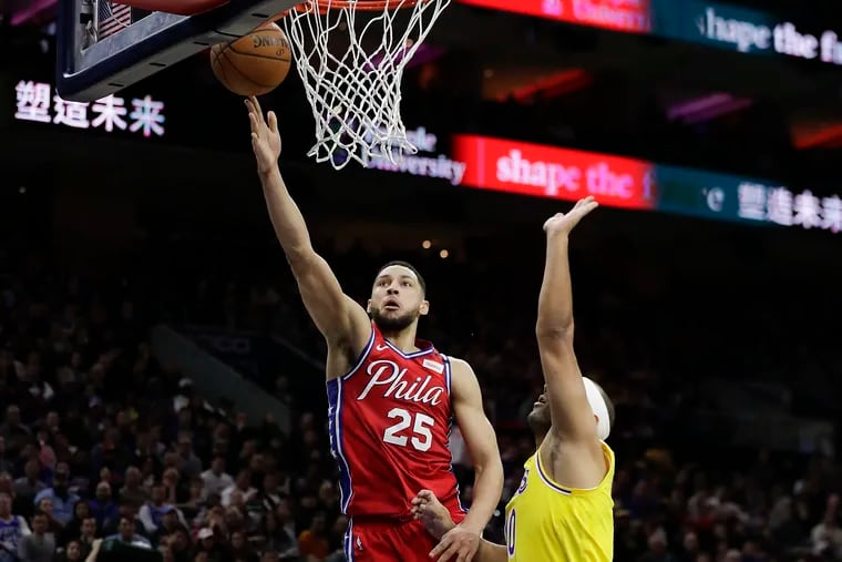 Ben Simmons scores past Lakers forward Jared Dudley in January.