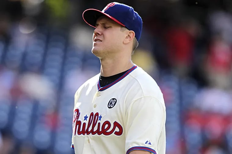 Phillies closer Jonathan Papelbon allowed four runs in the ninth against the Marlins on Sunday, earning the loss. (H. Rumph Jr/AP)