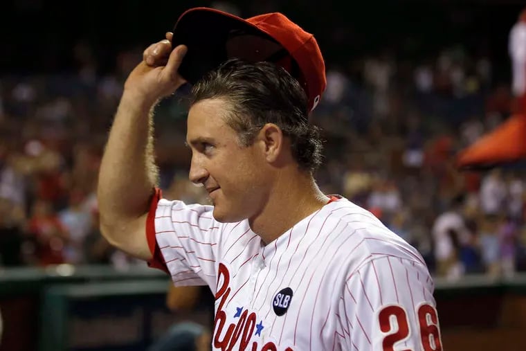 Chase Utley tips his cap as he leaves the field for the last time at Citizens Bank Park. The Southern California native was traded to the Dodgers. YONG KIM / Staff Photographer