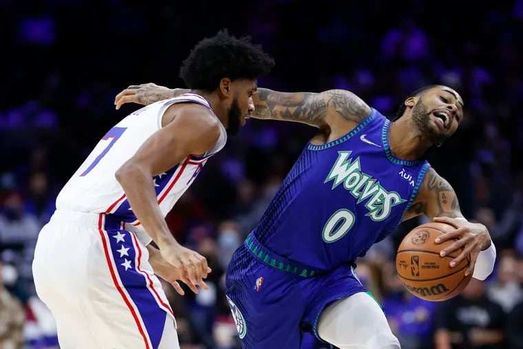 Minnesota Timberwolves guard D'Angelo Russell gets fouled by Sixers guard Isaiah Joe during the fourth quarter on Saturday.