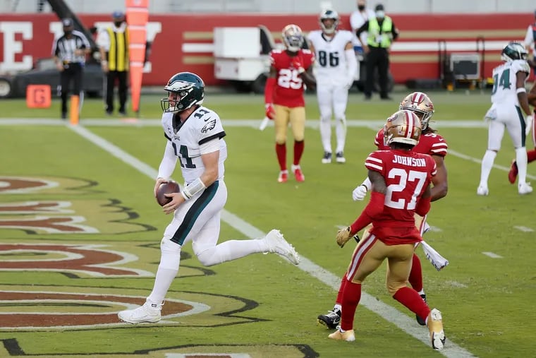 Carson Wentz runs in for a touchdown in the first quarter against the 49ers on Sunday night.