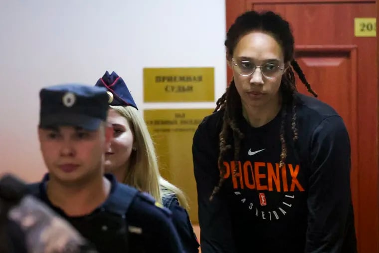 WNBA star Brittney Griner getting escorted to a courtroom for a hearing in Khimki, Russia, on Wednesday.