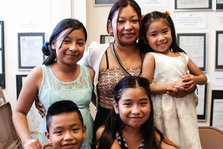 Blanca Bautista (second from right, rear) and her children (clockwise from left), Diana, Abril, Estefani, and Jose Manuel, hope for the release of Jose Manuel Benito de Castilla, who was arrested during a search for someone else. MATTHEW HALL / Staff Photographer