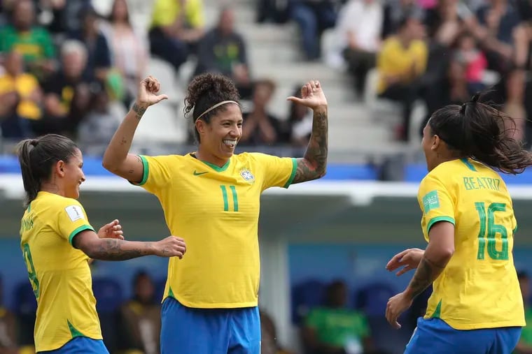 Brazil's Cristiane (center) celebrates after scoring her side's opening goal against Jamaica.