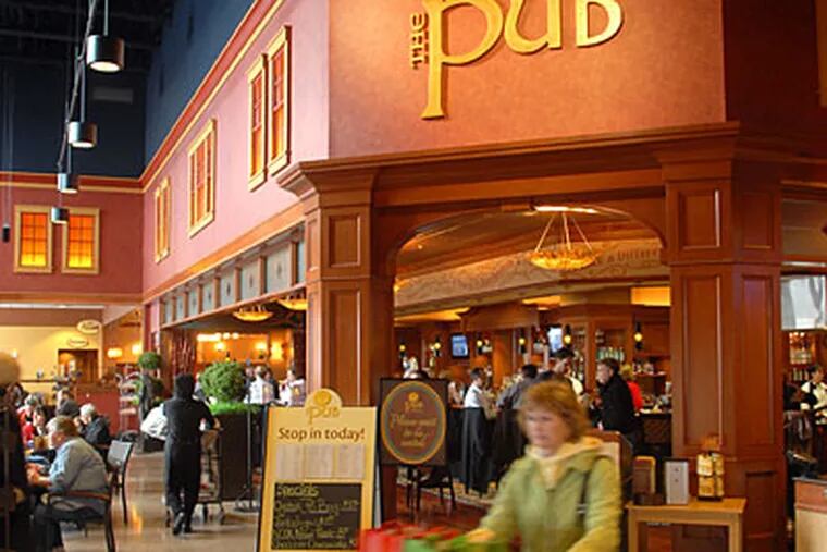 The Pub at Wegmans in Collegeville is a full-service restaurant with a liquor license — unusual, to say the least, for a supermarket in Pennsylvania. (TOM GRALISH / Staff Photographer)