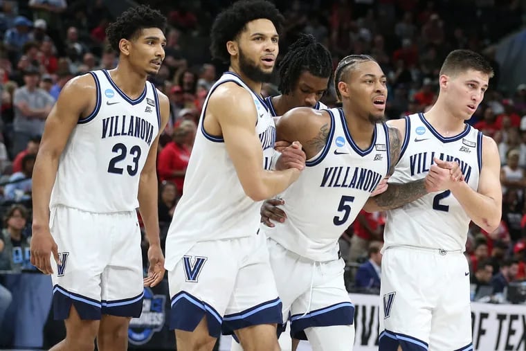 Villanova's Justin Moore helped off the court late in last season's NCAA Elite Eight game after suffering a torn Achilles.
