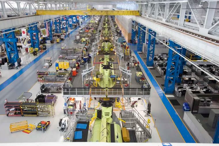 The U.S. Army Chinook helicopter assembly line, above, and the V-22 Osprey building at Boeing in Ridley Park. The plant just got a $265 million contract for nine more Chinook helicopters.