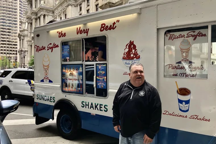 John McNesby, president of Lodge 5 of the Fraternal Order of Police, stands in front of the Mister Softee truck he parked in front of Philadelphia District Attorney Larry Krasner's office on April 30. The FOP gave away free ice cream while deriding Krasner as "soft on crime" and asking people to vote for his Democratic primary challenger, Carlos Vega.