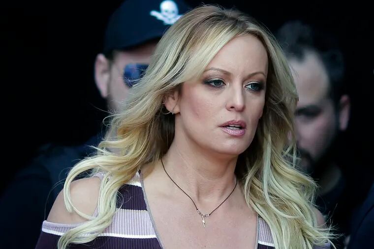 FILE - In this Oct. 11, 2018, file photo, adult film actress Stormy Daniels arrives at the adult entertainment fair "Venus" in Berlin. A federal judge has thrown out a lawsuit against President Donald Trump by Daniels that sought to tear up a hush-money settlement about their alleged affair. Judge S. James Otero ruled Thursday, March 7, 2019, in U.S. District Court that the suit was irrelevant after Trump and his former personal lawyer agreed to rescind a nondisclosure agreement Daniels signed in exchange for a $130,000 payment.