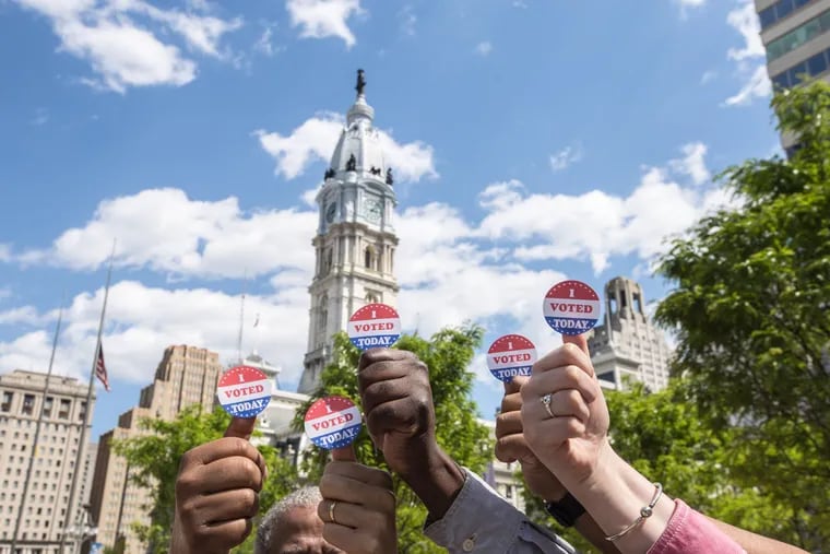 I VOTED TODAY stickers displayed with City Hall in the background during the May 21, 2019 election.