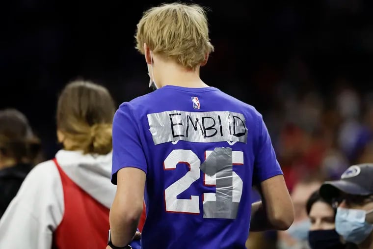 This fan at a Sixers preseason game last week replaced guard Ben Simmons' name and number on his T-shirt with center Joel Embiid's name and number.