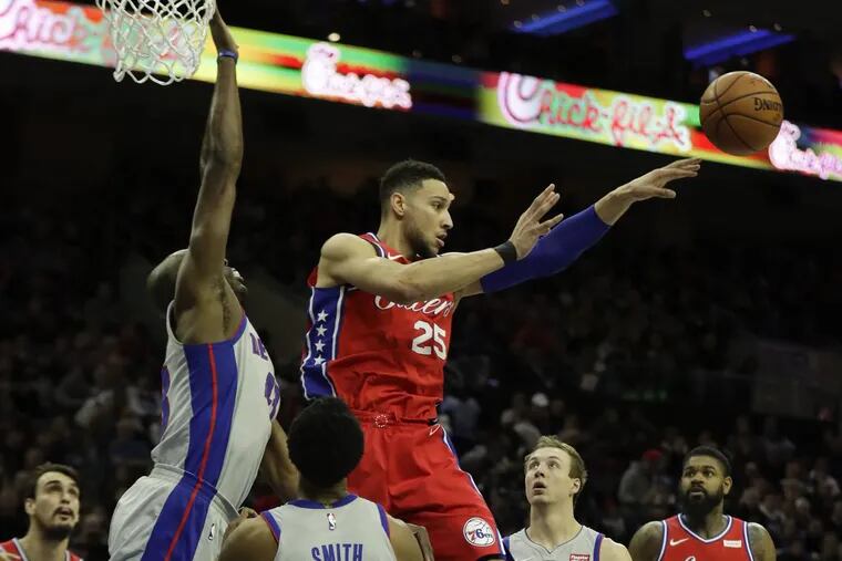 Sixers guard Ben Simmons passes the basketball past Detroit Pistons forward Anthony Tolliver (left), guard Ish Smith and guard Luke Kennard during the second-quarter on Friday, January 5, 2018 in Philadelphia.
