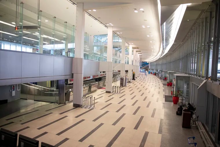 Philadelphia International Airport's Terminal A West is where a person with measles recently traveled through the federal inspection area, possibly exposing others. In this file photo from March 2020, it was empty due to travel bans at the start of the coronavirus shutdowns.