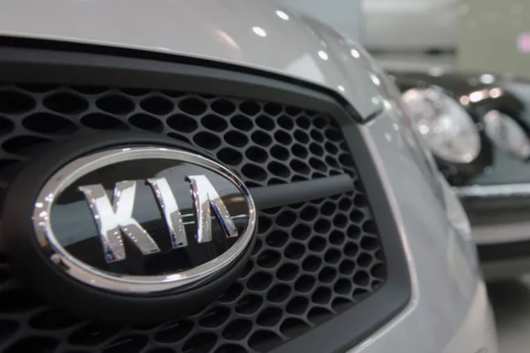 Kia Motors Corp. and its affiliate, Hyundai Motor Co., said they would freeze pay for managers as demand slid.