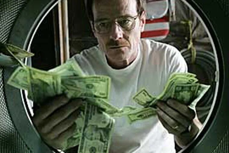 Walter White (Bryan Cranston) (literally) launders money in "Breaking Bad."