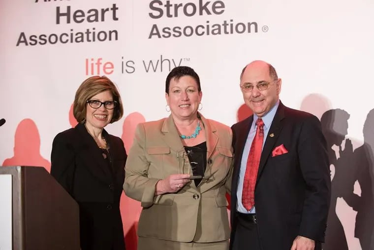 Theresa Conejo, at center, was recently honored by the American Heart Association. With her are heart association CEO Nancy Brown and past president Elliott Antnan M.D.