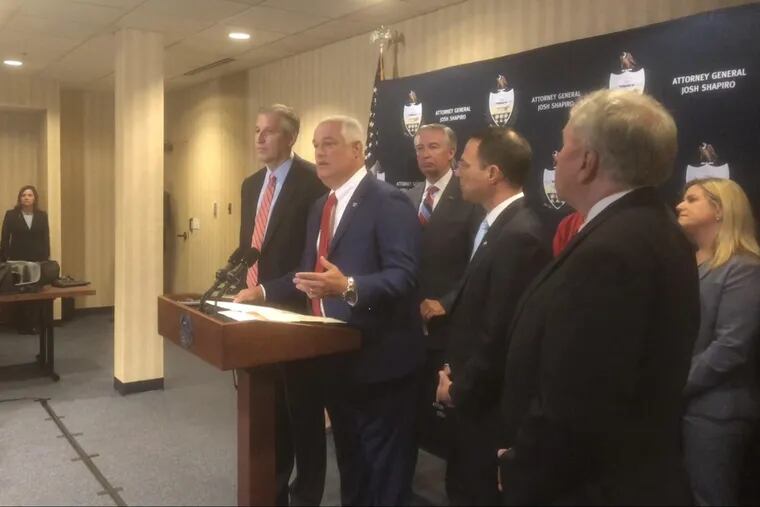 Bucks County District Attorney Matt Weintraub speaks at a news conference concerning reforms being pushed by a grand jury regarding Pennsylvania's sex-abuse laws. He was joined by (from left) state Sen. Todd Stephens state Attorney General Josh Shapiro and state Rep. John Rafferty.