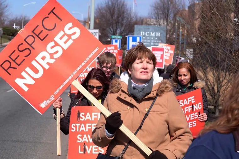 Striking nurses picketed outside Delaware County Memorial Hospital in March 2017, a year after their new owners took over.
